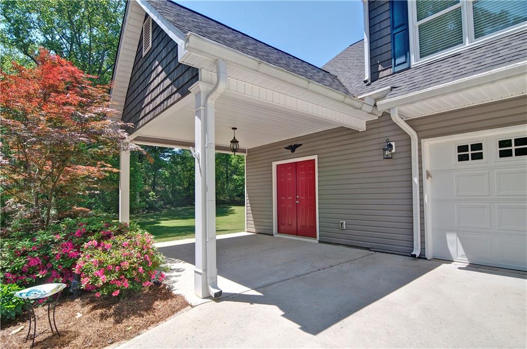 5800 Villa Rica Highway Dallas, GA 30157 - Photo 3 of 37 a view of a porch with a flower garden
