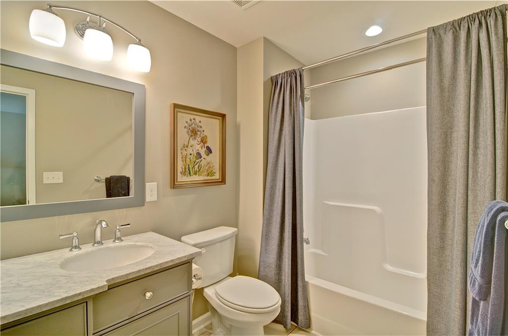 5800 Villa Rica Highway Dallas, GA 30157 - Photo 33 of 37 a bathroom with a granite countertop sink toilet and shower