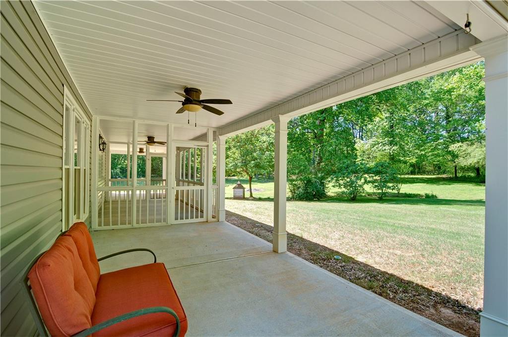 5800 Villa Rica Highway Dallas, GA 30157 - Photo 7 of 37 a backyard of a house with a garden and deck