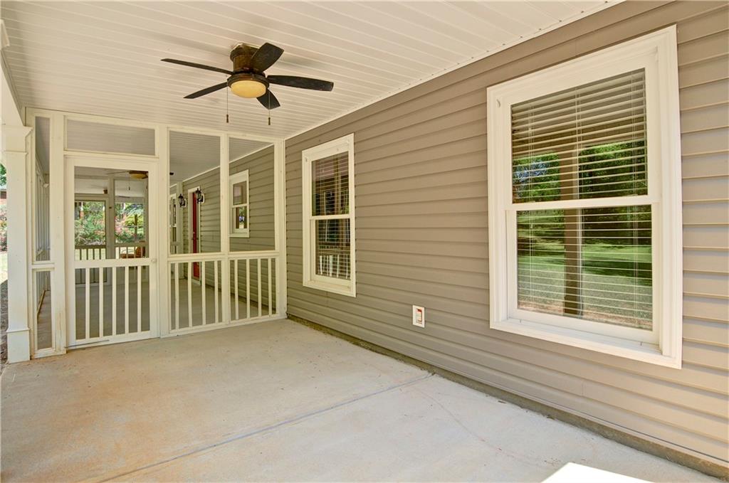 5800 Villa Rica Highway Dallas, GA 30157 - Photo 8 of 37 a view of a livingroom with a ceiling fan and window