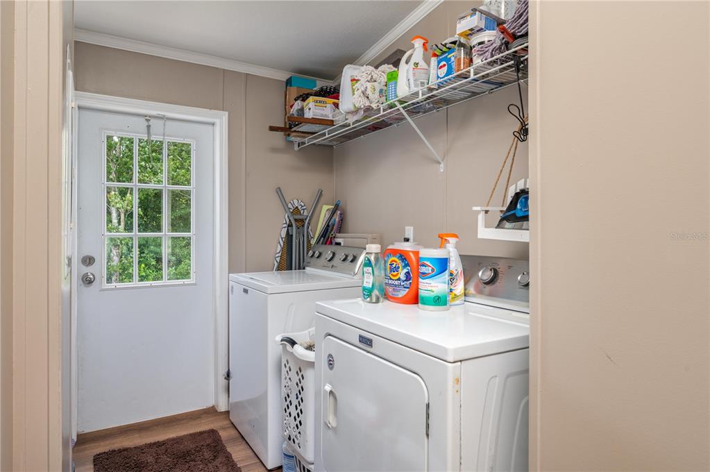 15079 Brahma Road Polk City, FL 33868 - Photo 24 of 40 a utility room with dryer and washer