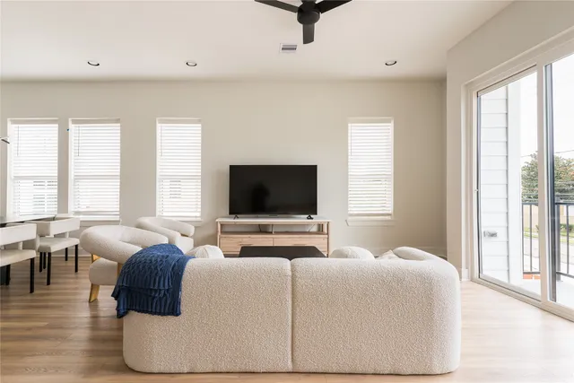 a kitchen with stainless steel appliances a stove a sink island and a refrigerator