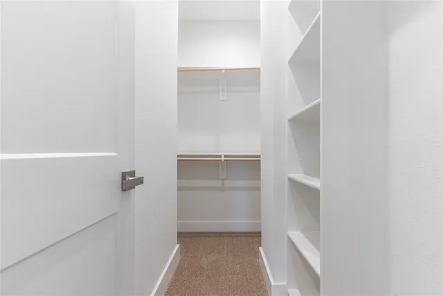a view of an empty walk in closet