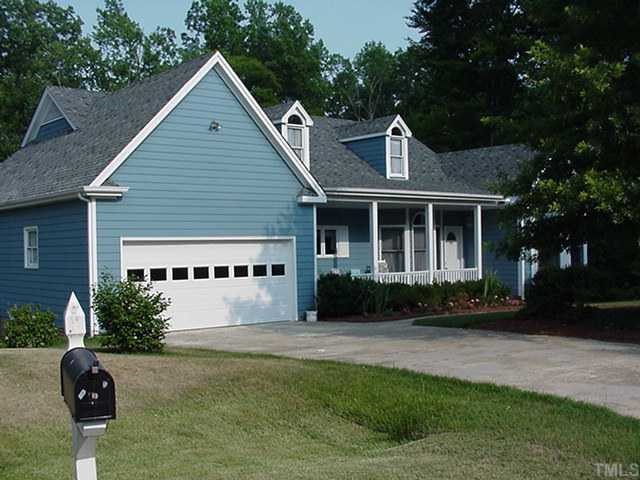 10008 Kilnstone Lane Raleigh, NC 27613 - Photo 1 of 1 a front view of a house with garden
