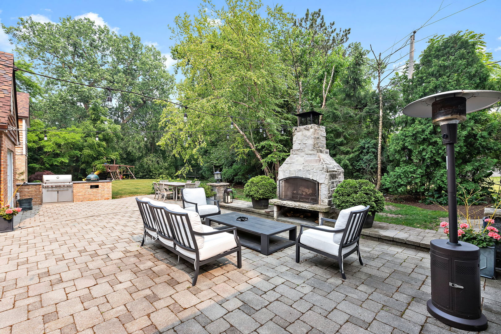 180 Old Farm Road Northfield, IL 60093 - Photo 36 of 41 a view of a patio with a chairs and table in a patio