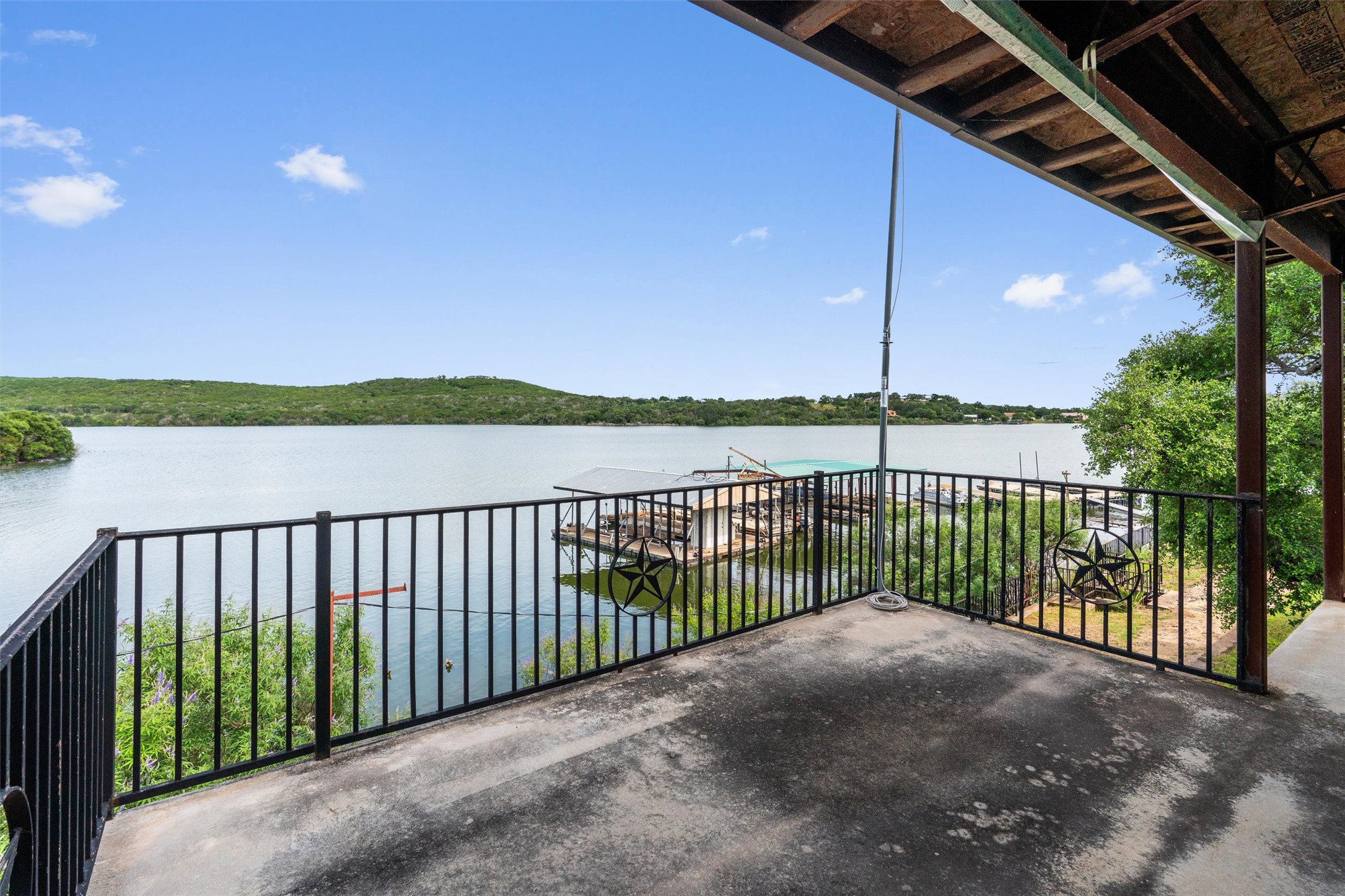 325 Eagle Rest Burnet, TX 78611 - Photo 17 of 40 Enjoy tranquil lake views from this expansive, shaded patio with a sturdy railing.