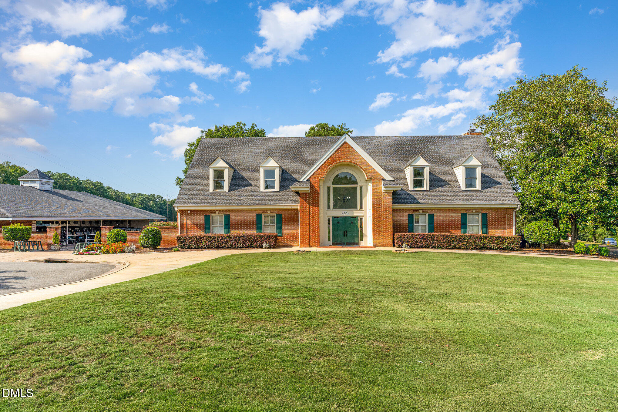 2215 Turtle Point Drive Raleigh, NC 27604 - Photo 18 of 25 a front view of a house with a garden