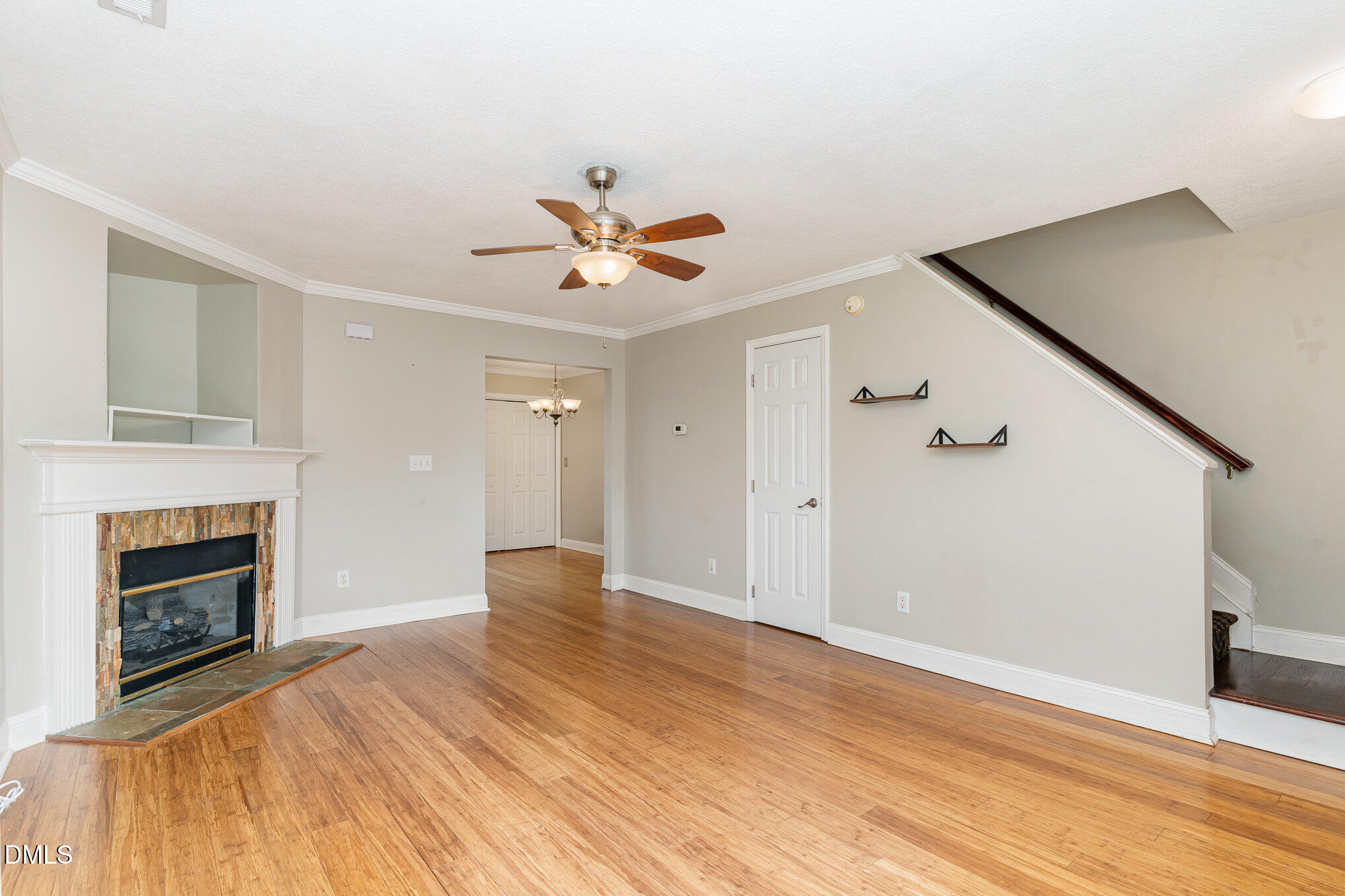 2215 Turtle Point Drive Raleigh, NC 27604 - Photo 2 of 25 a view of a livingroom with a fireplace and wooden floor