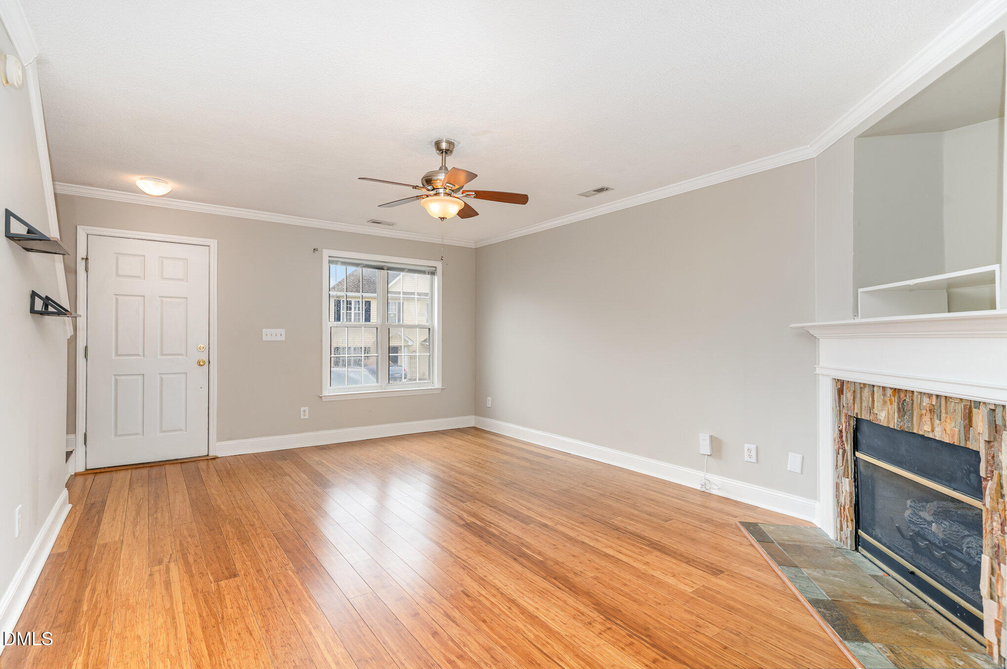 2215 Turtle Point Drive Raleigh, NC 27604 - Photo 8 of 25 a view of an empty room with wooden floor and a window