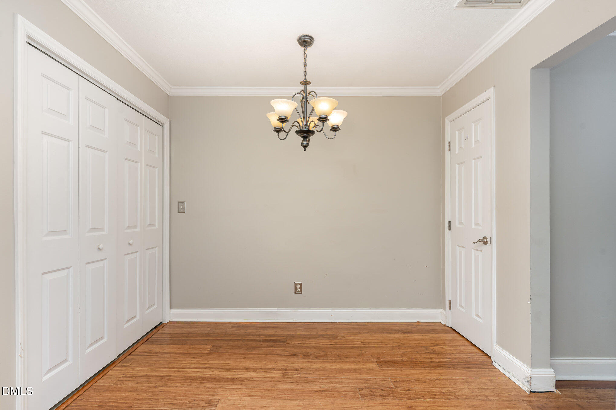 2215 Turtle Point Drive Raleigh, NC 27604 - Photo 10 of 25 wooden floor in an empty room with a window