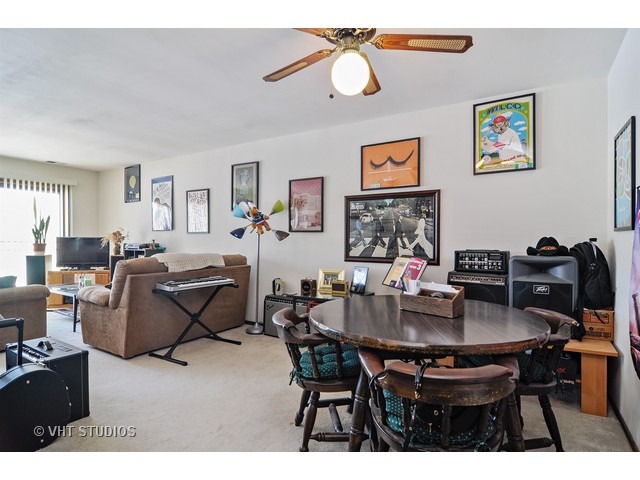 1400 North Elmhurst Road, Unit 313 Mount Prospect, IL 60056 - Photo 3 of 10 a view of a dining room with furniture