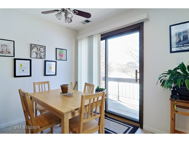 1400 North Elmhurst Road, Unit 313 Mount Prospect, IL 60056 - Photo 6 of 10 a view of a dining room with furniture window and outside view