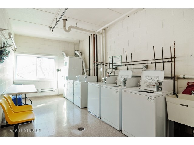1400 North Elmhurst Road, Unit 313 Mount Prospect, IL 60056 - Photo 9 of 10 a view of a kitchen with furniture and windows