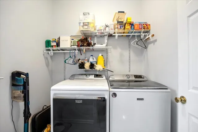 a balcony with wooden floor and yard in the back