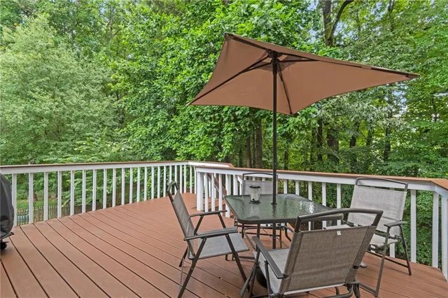 an outdoor view of patio with umbrella