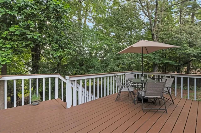 a view of a yard with large trees