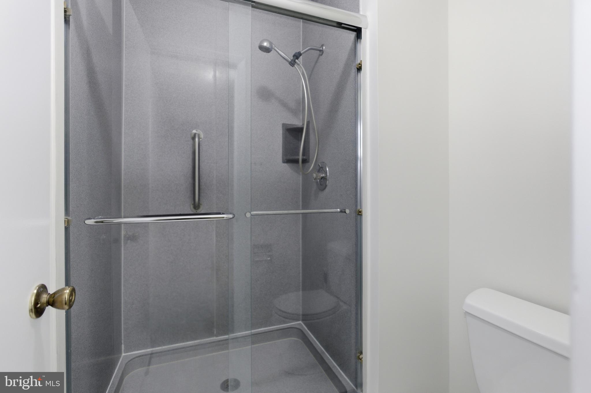 14717 Flintstone Lane Silver Spring, MD 20905 - Photo 16 of 32 a bathroom with a shower