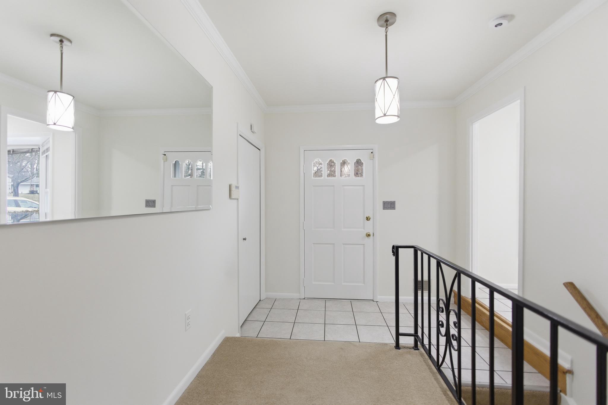 14717 Flintstone Lane Silver Spring, MD 20905 - Photo 19 of 32 a view of a hallway with wooden floor and staircase
