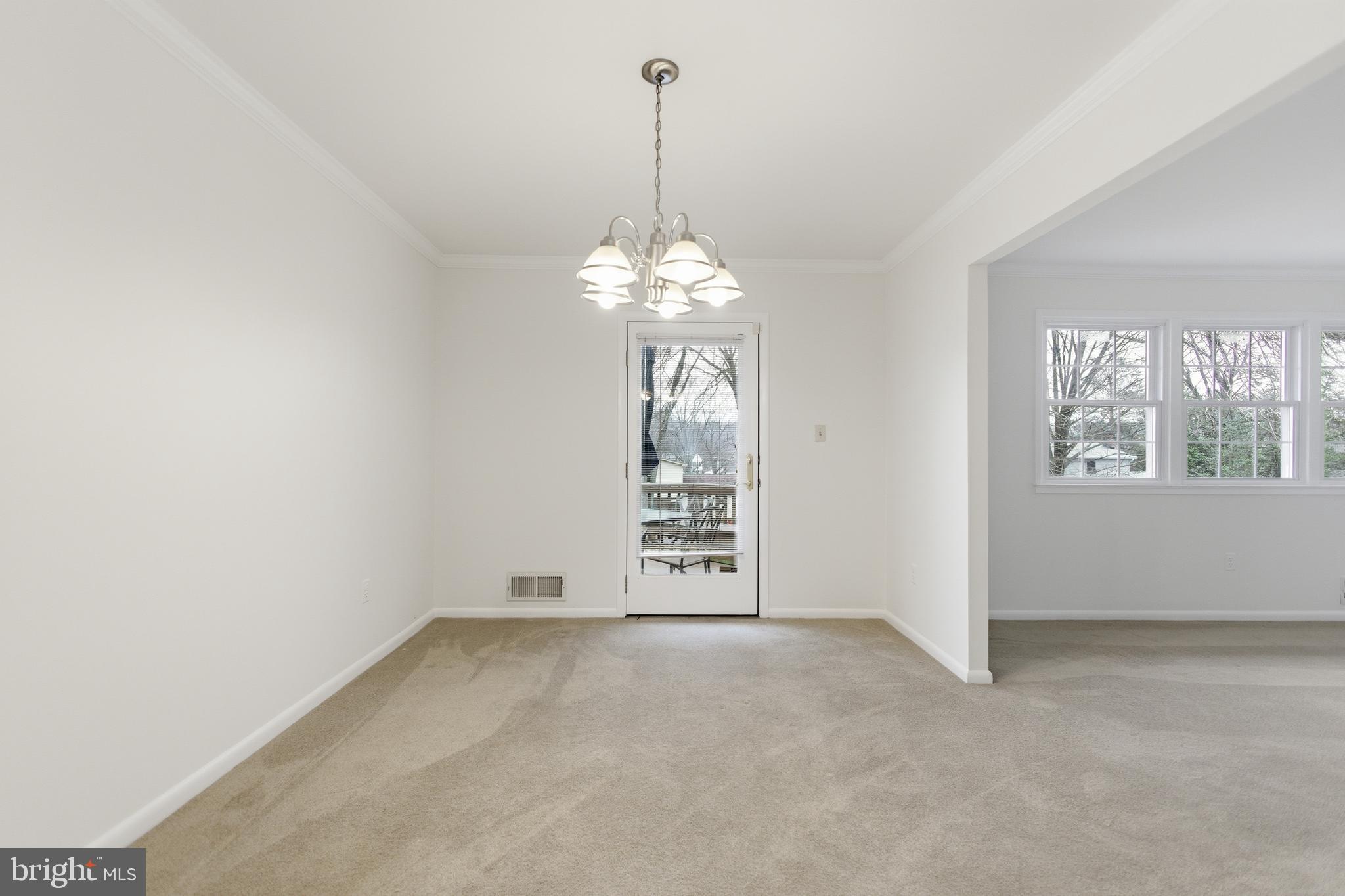 14717 Flintstone Lane Silver Spring, MD 20905 - Photo 21 of 32 a view of a chandelier in big room and chandelier fan