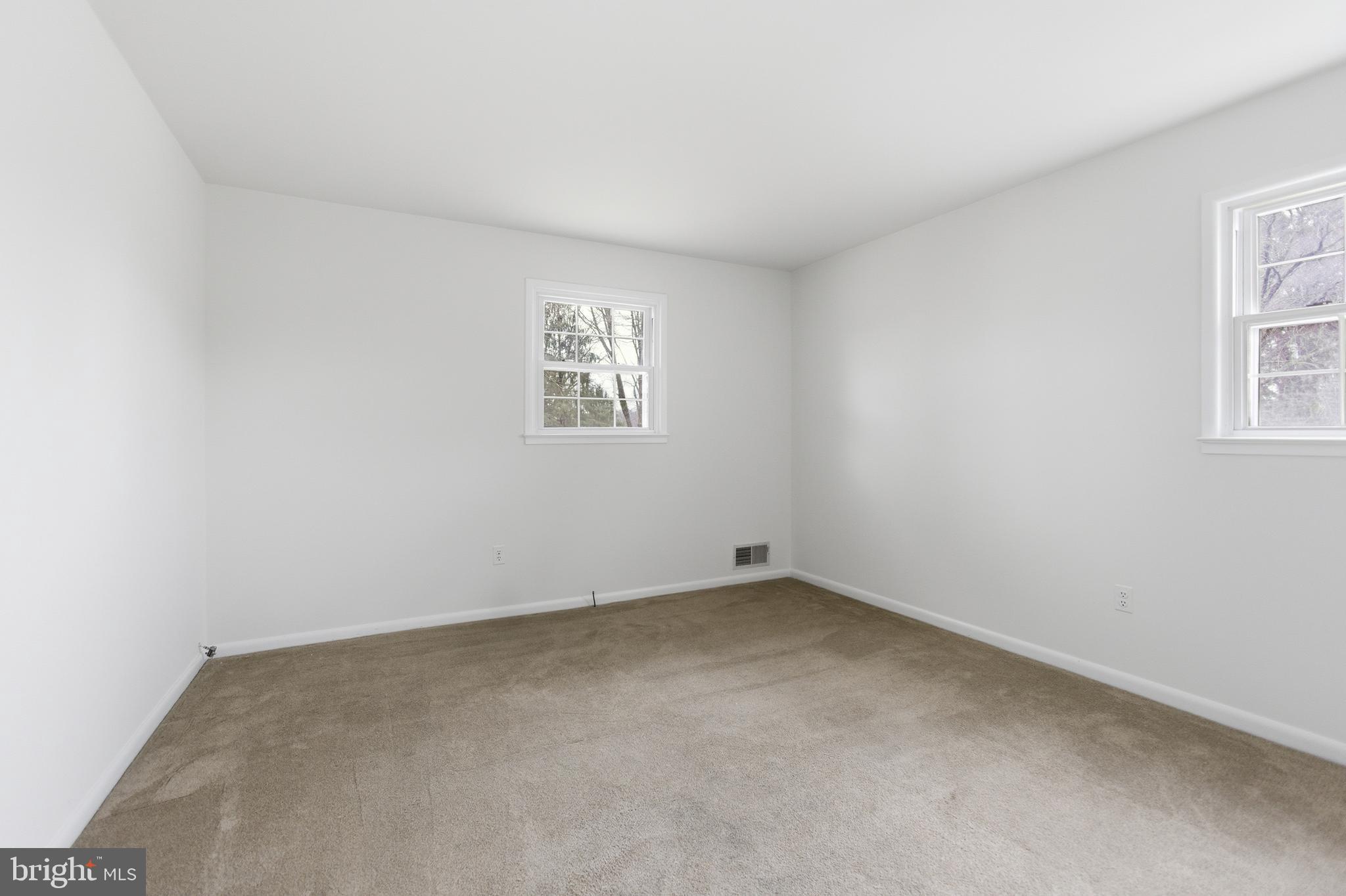 14717 Flintstone Lane Silver Spring, MD 20905 - Photo 25 of 32 an empty room with windows