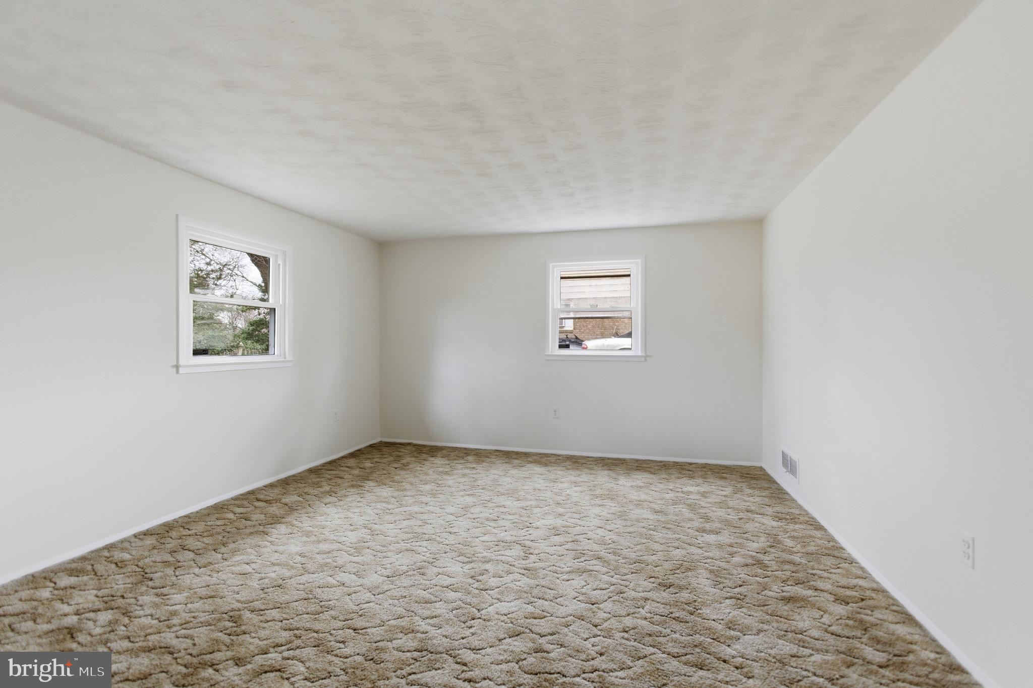 14717 Flintstone Lane Silver Spring, MD 20905 - Photo 29 of 32 an empty room with windows