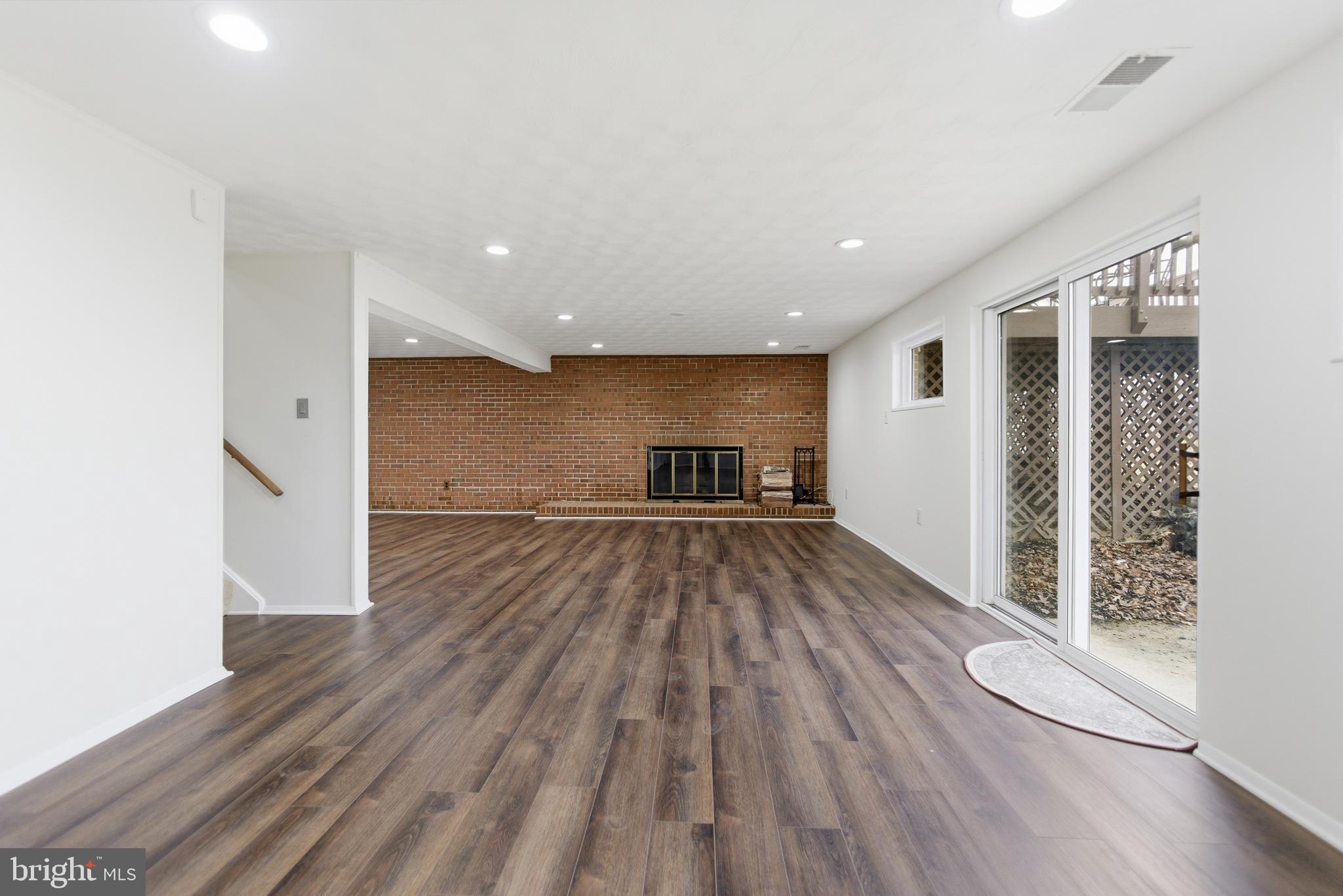 14717 Flintstone Lane Silver Spring, MD 20905 - Photo 3 of 32 a view of empty room with wooden floor