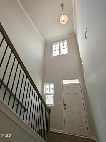 a view of an entryway with wooden floor