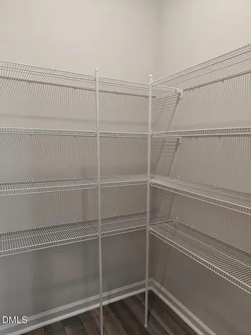 a view of a room with racks on the wall