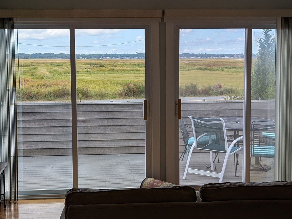 44 Old Point Road Newbury, MA 01951 - Photo 3 of 9 a view of an empty room and floor to ceiling window