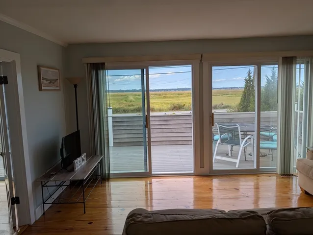 a view of a living room and hardwood floor