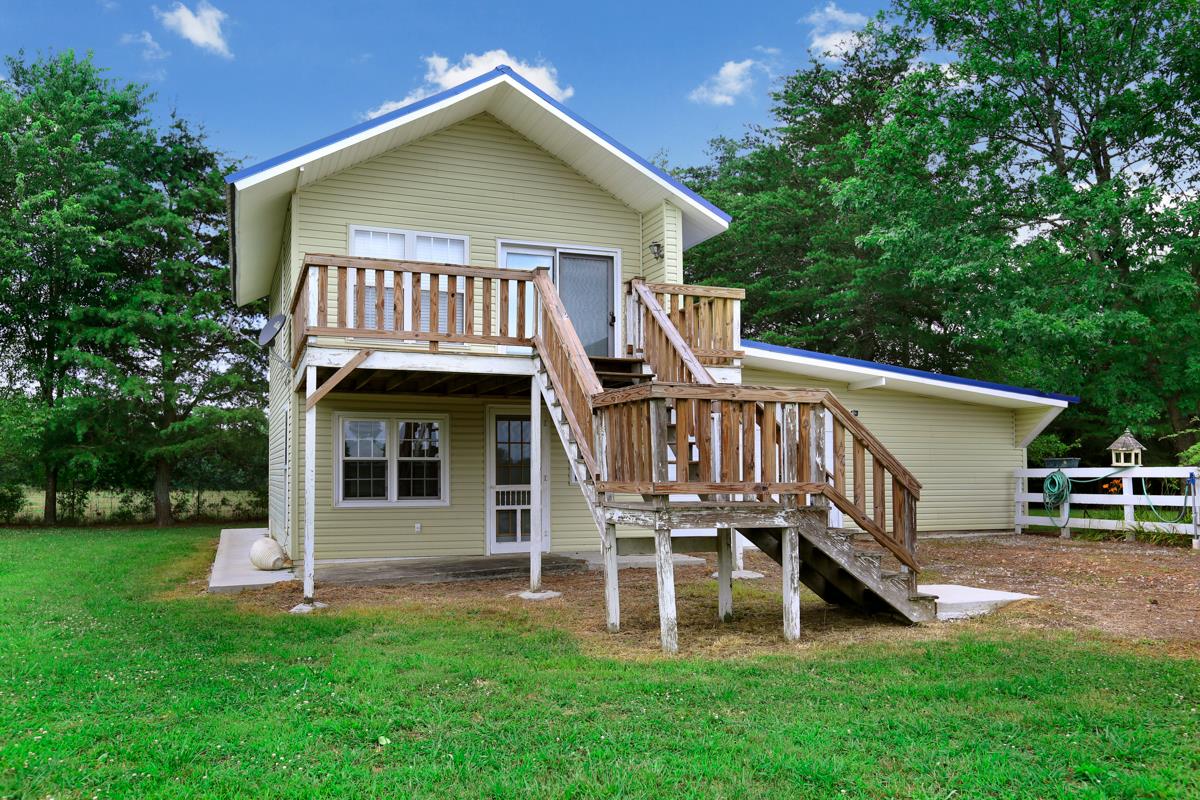 1747 Macedonia Road Ardmore, AL 35739 - Photo 15 of 17 a view of a house with a yard deck and a large tree