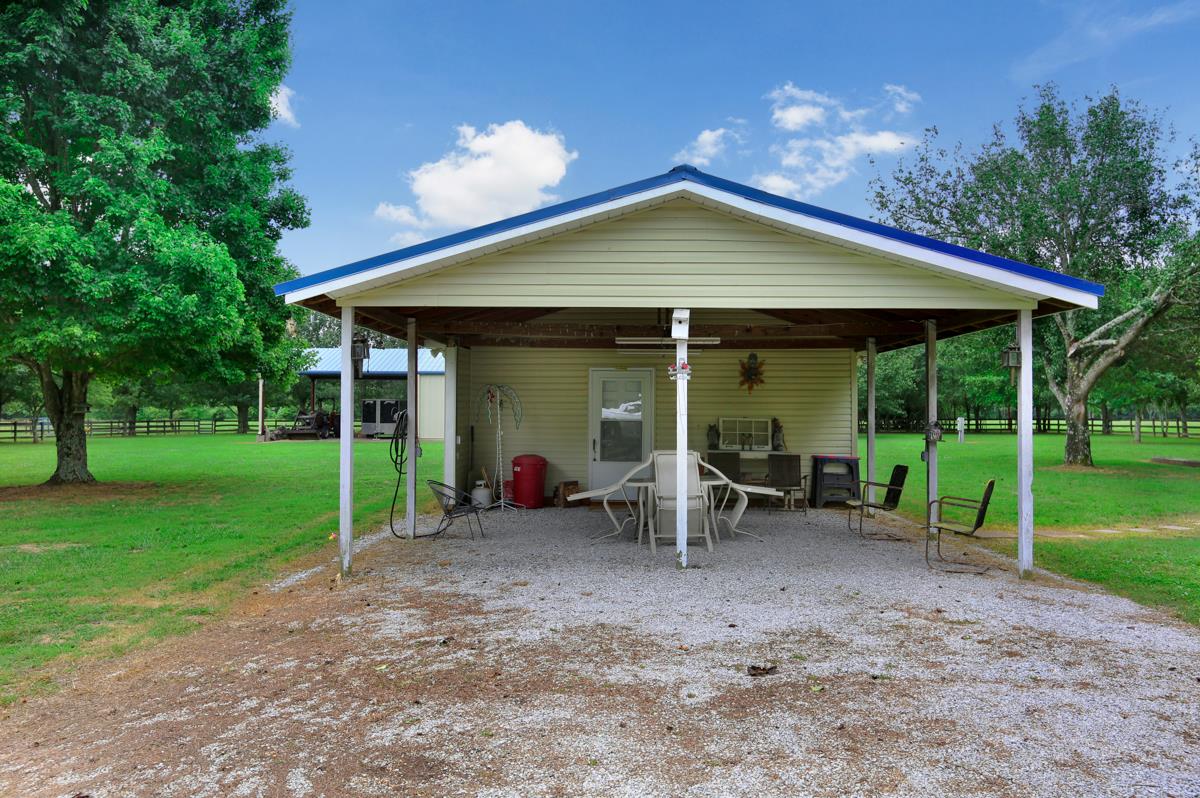 1747 Macedonia Road Ardmore, AL 35739 - Photo 10 of 17 a view of a house with backyard and porch
