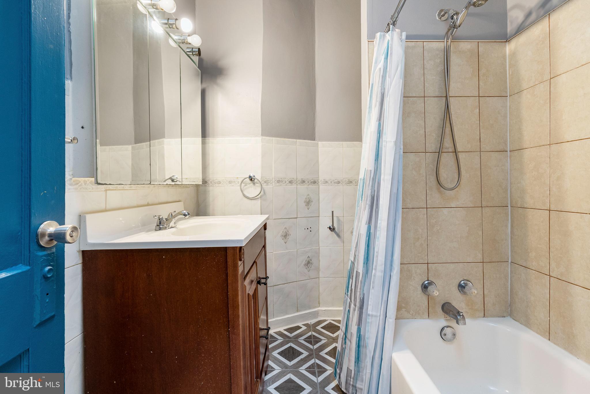 4610 Belair Road Baltimore, MD 21206 - Photo 15 of 28 Full Bathroom with Tub and Shower