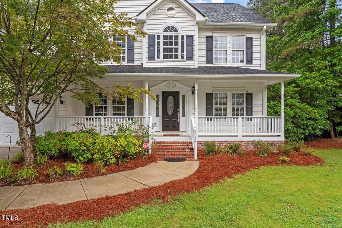 1817 Foxbrook Drive Raleigh, NC 27603 - Photo 16 of 61 front view of a house with a yard