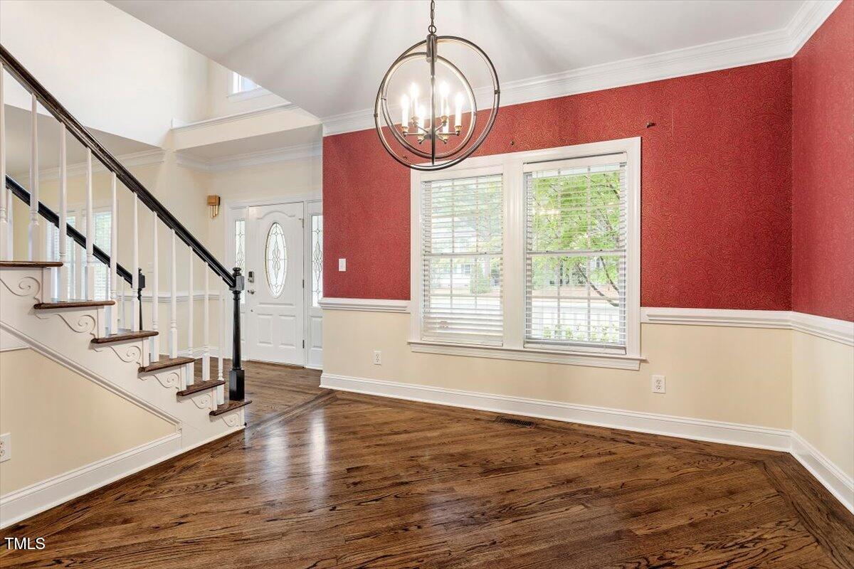 1817 Foxbrook Drive Raleigh, NC 27603 - Photo 20 of 61 a view of an entryway with wooden floor door