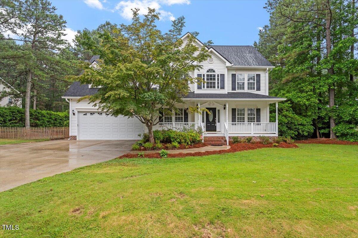 1817 Foxbrook Drive Raleigh, NC 27603 - Photo 2 of 61 a view of a house with a yard and sitting area
