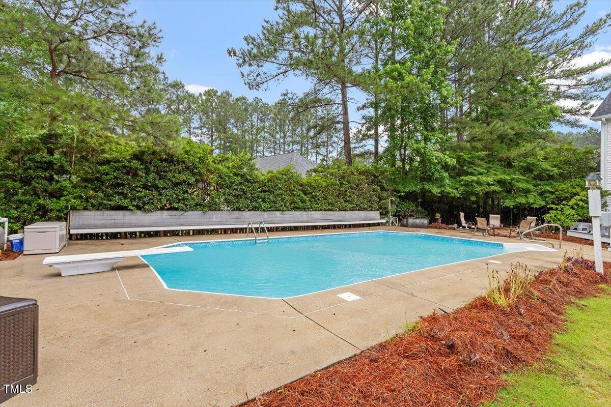 1817 Foxbrook Drive Raleigh, NC 27603 - Photo 45 of 61 a view of a swimming pool with an outdoor space