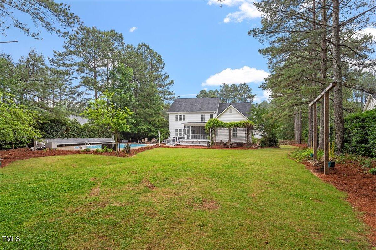 1817 Foxbrook Drive Raleigh, NC 27603 - Photo 46 of 61 a house with swimming pool in front of it