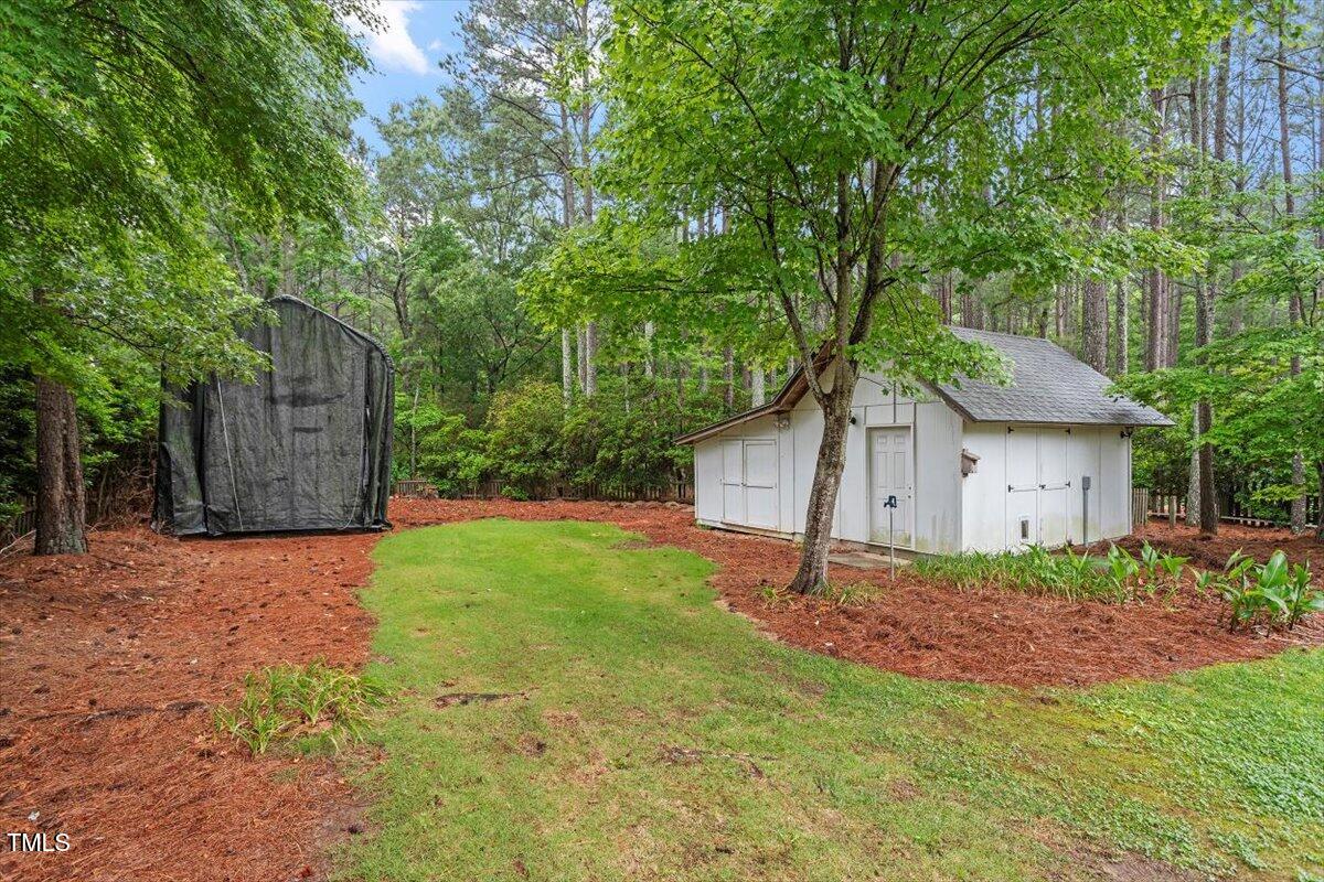 1817 Foxbrook Drive Raleigh, NC 27603 - Photo 48 of 61 a white house that has a tree in front of it