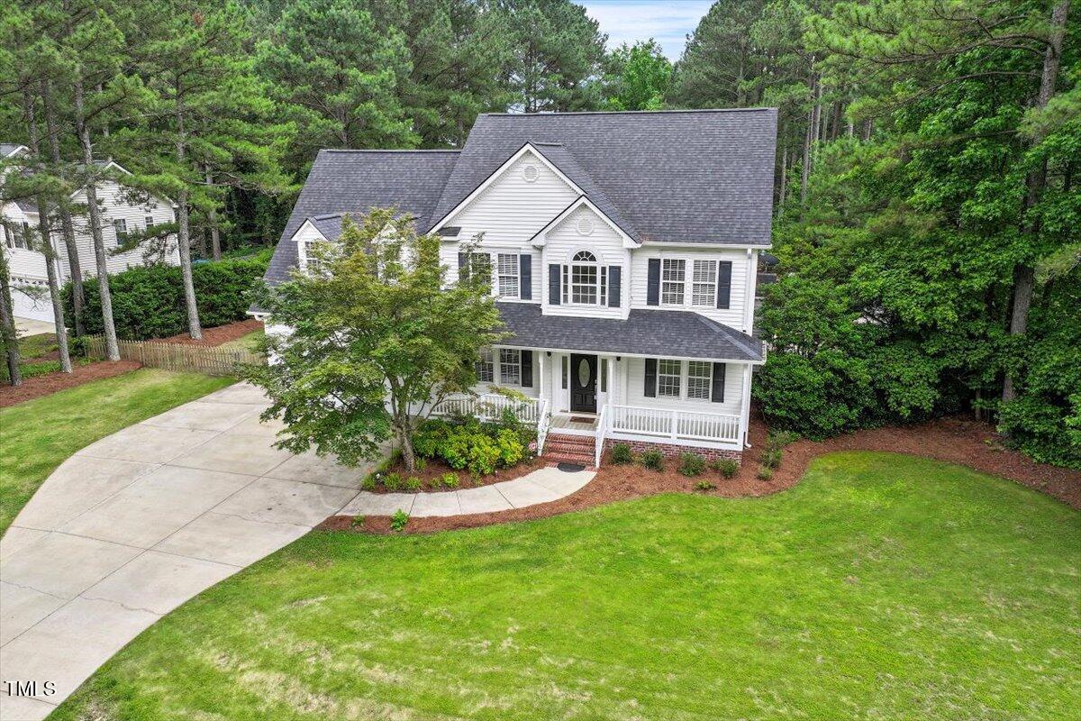 1817 Foxbrook Drive Raleigh, NC 27603 - Photo 52 of 61 a view of a house with a yard and sitting area