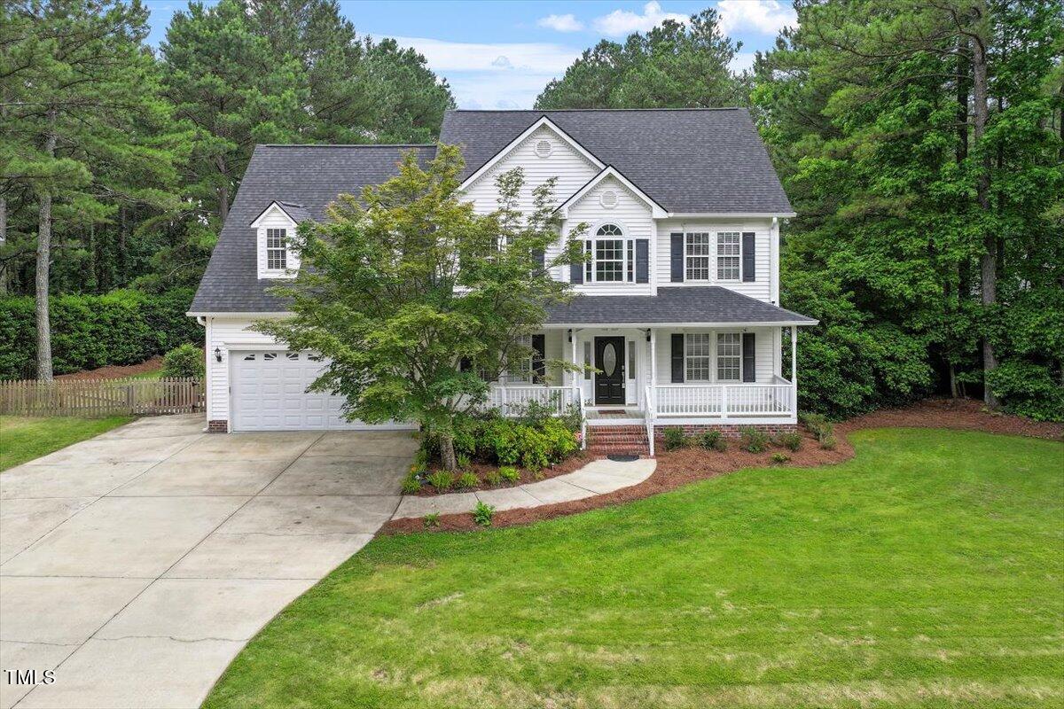 1817 Foxbrook Drive Raleigh, NC 27603 - Photo 53 of 61 a front view of a house with yard and green space