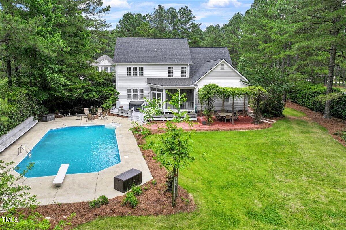 1817 Foxbrook Drive Raleigh, NC 27603 - Photo 56 of 61 a view of a house with a backyard porch and sitting area
