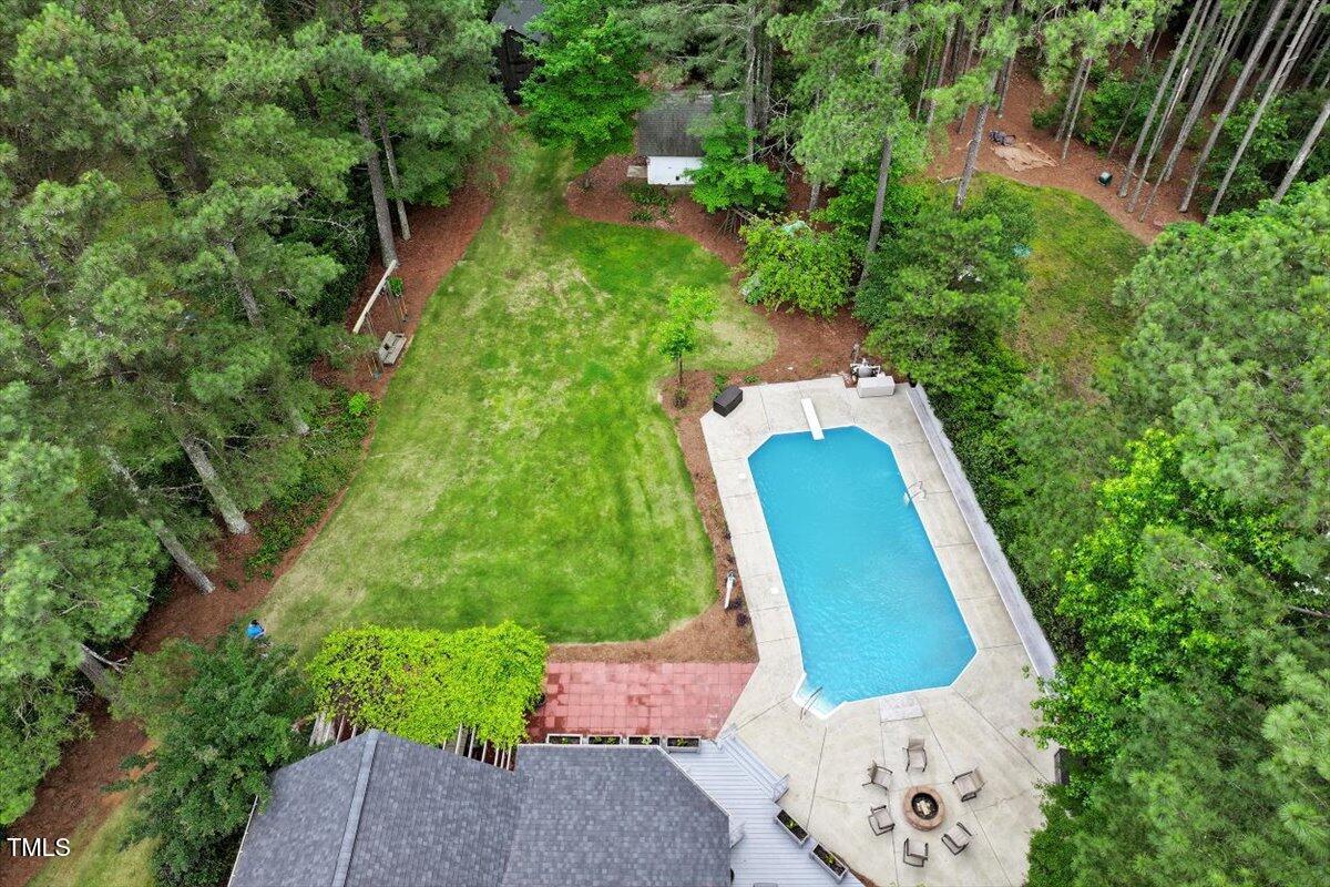 1817 Foxbrook Drive Raleigh, NC 27603 - Photo 58 of 61 an aerial view of a house with a yard and large trees