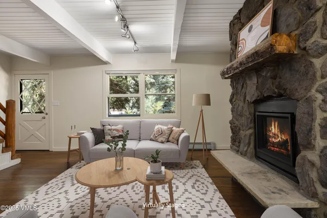 a living room with furniture and a fireplace