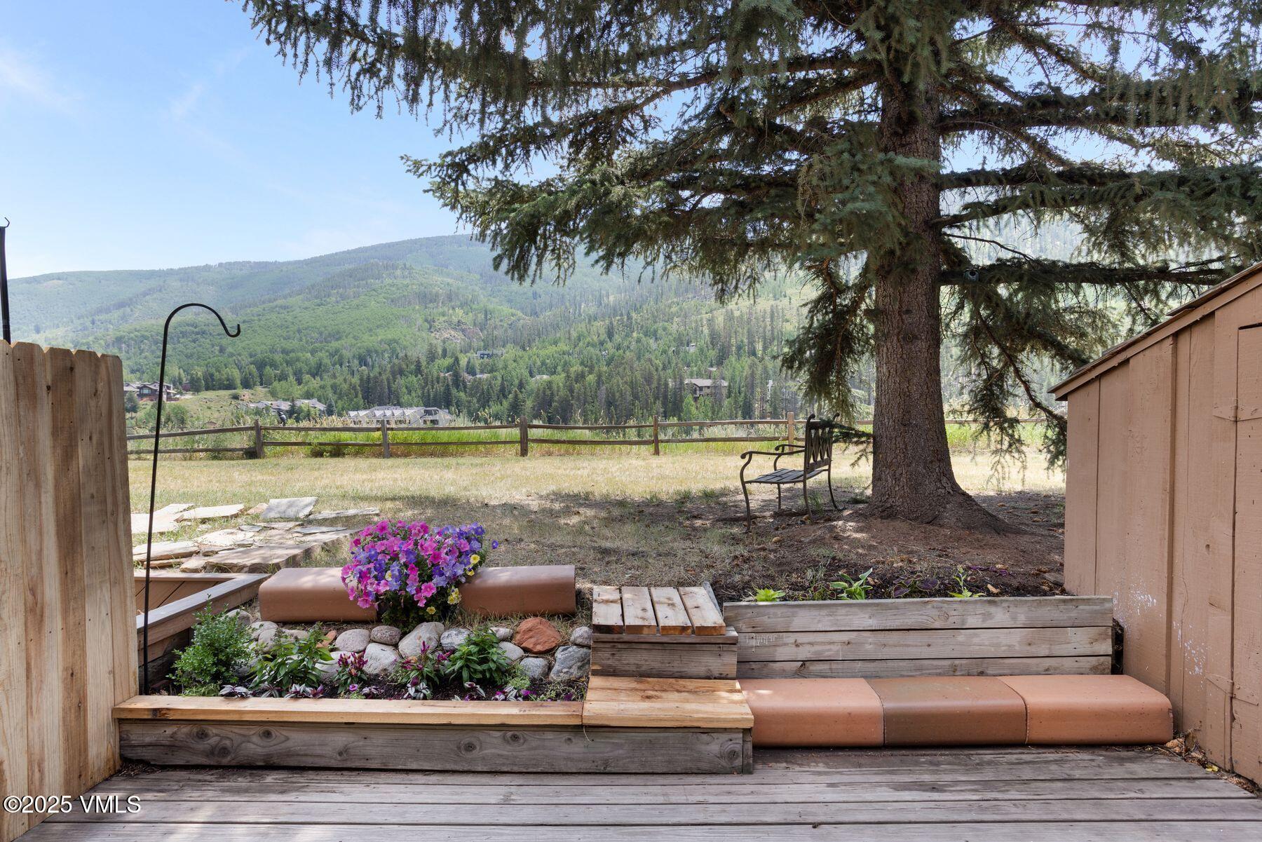2456 Chamonix Lane, Unit B3 Vail, CO 81657 - Photo 12 of 29 a front view of a house with a yard