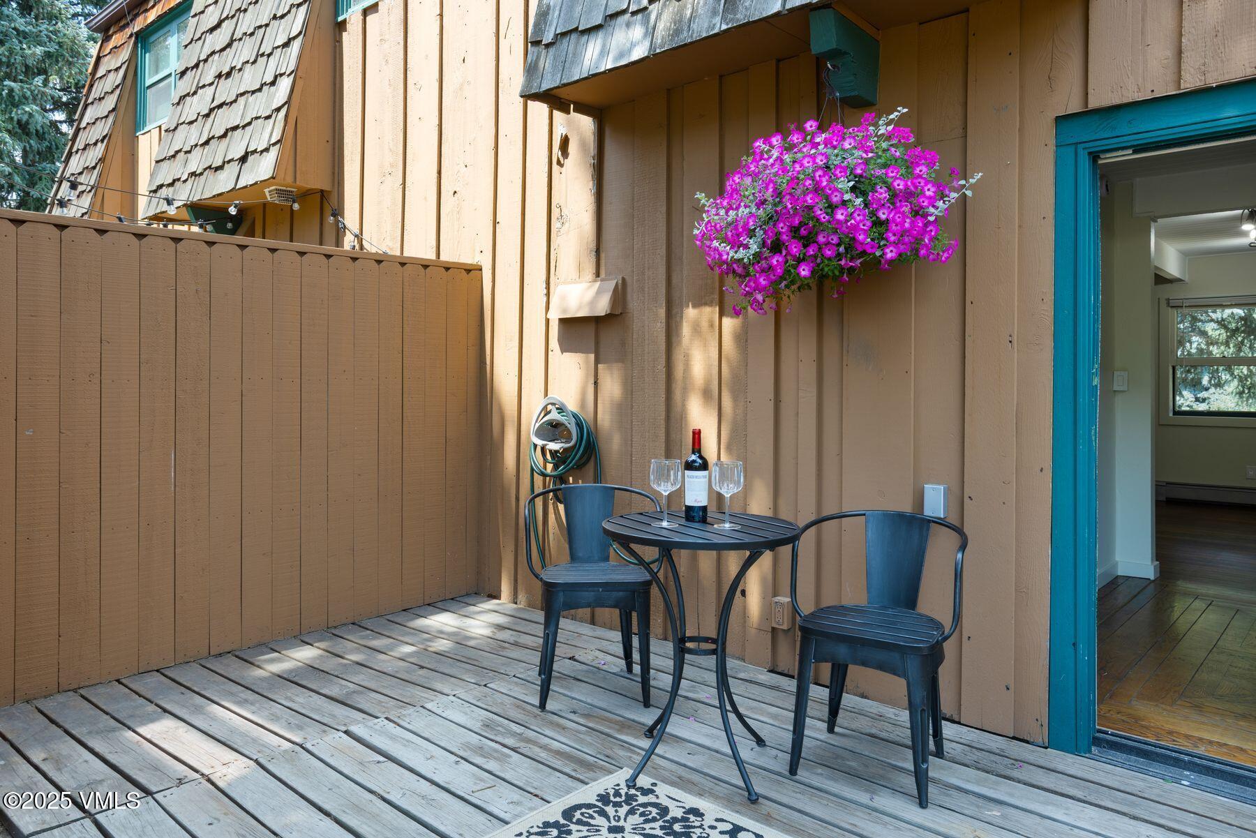 2456 Chamonix Lane, Unit B3 Vail, CO 81657 - Photo 16 of 29 a front view of a house with wooden floor and bench