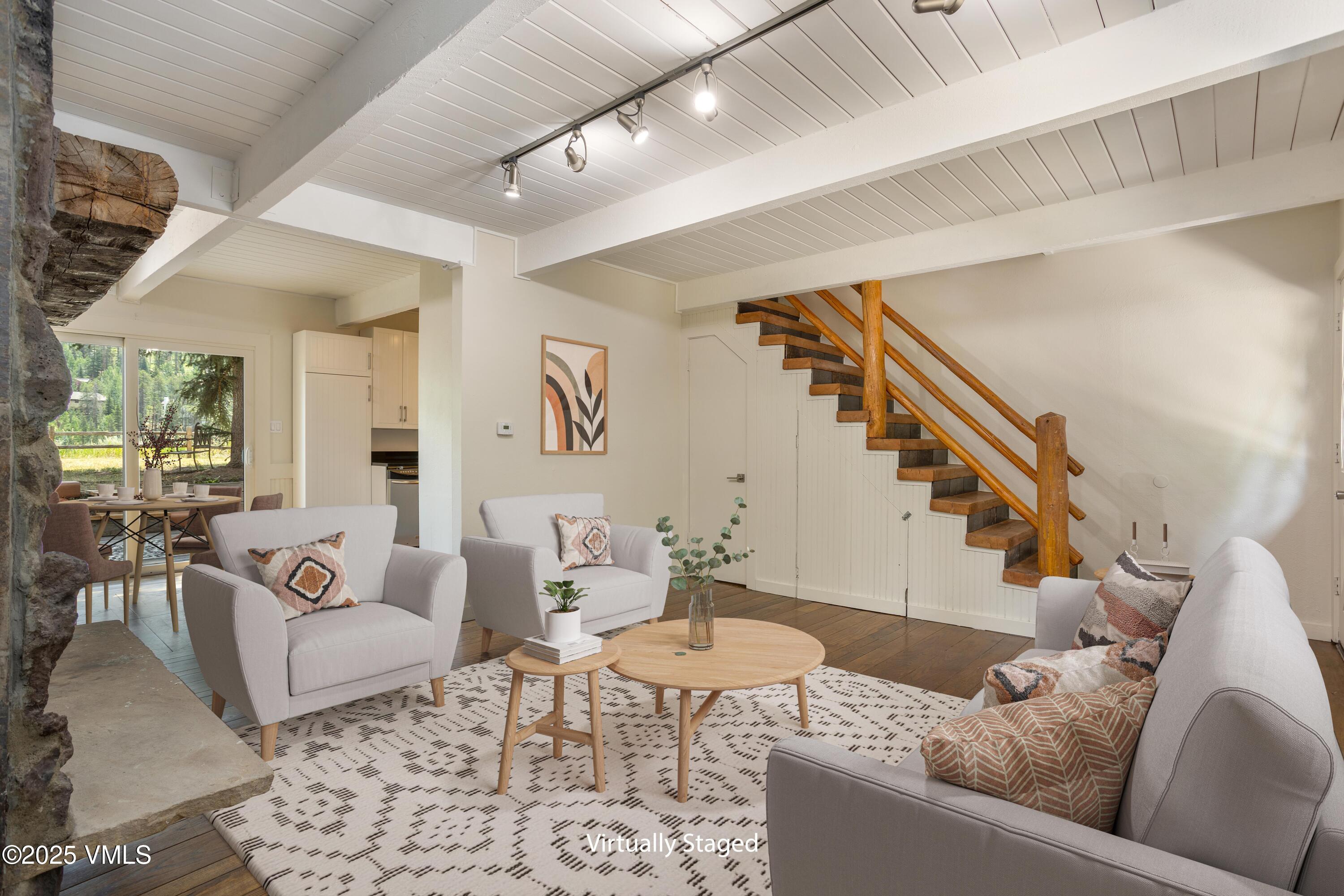 2456 Chamonix Lane, Unit B3 Vail, CO 81657 - Photo 17 of 29 a living room with furniture and wooden floor