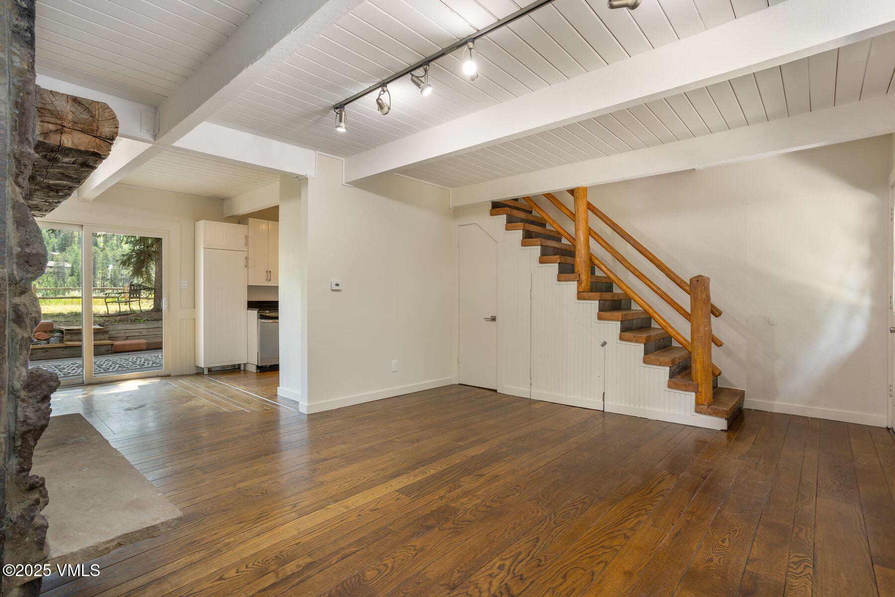 2456 Chamonix Lane, Unit B3 Vail, CO 81657 - Photo 18 of 29 a view of an entryway with wooden floor and stairs