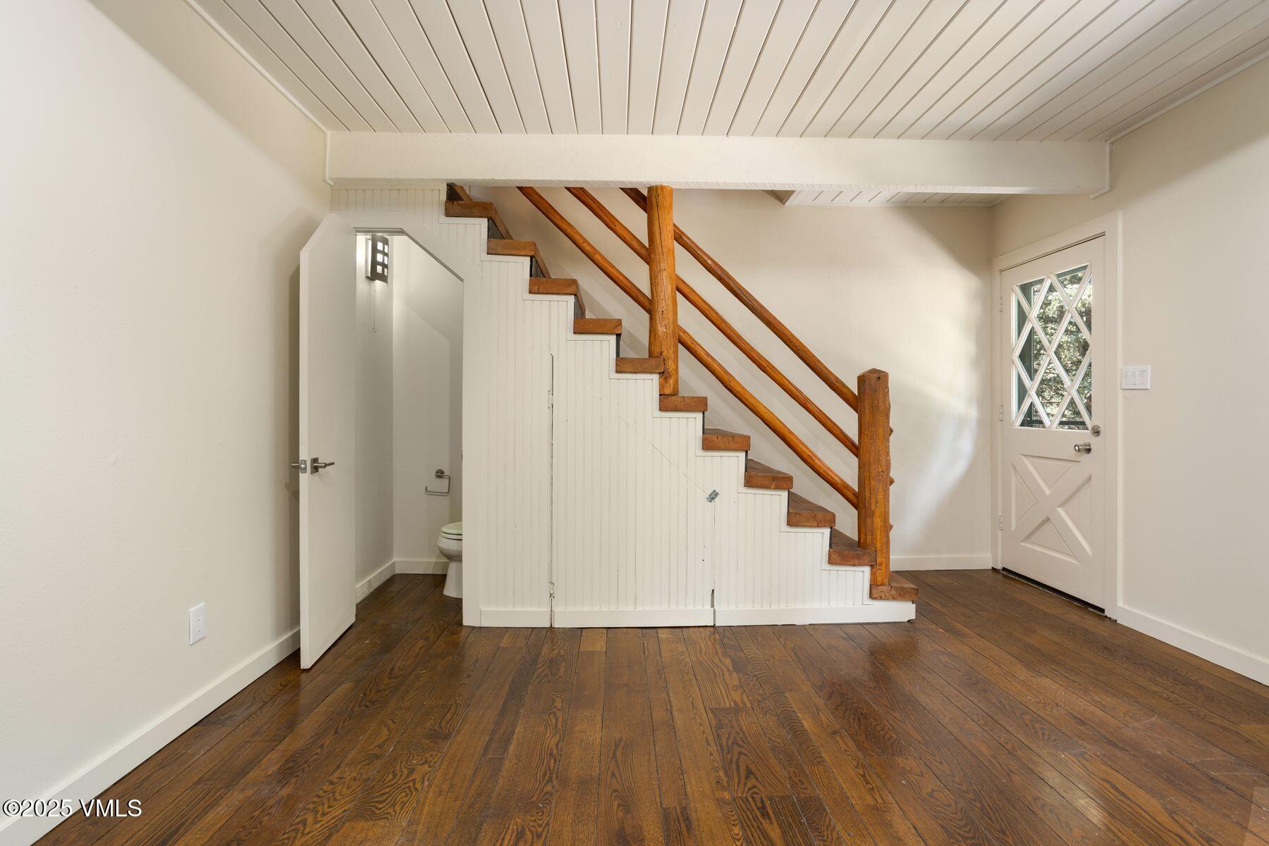 2456 Chamonix Lane, Unit B3 Vail, CO 81657 - Photo 19 of 29 wooden floor in an empty room with a window