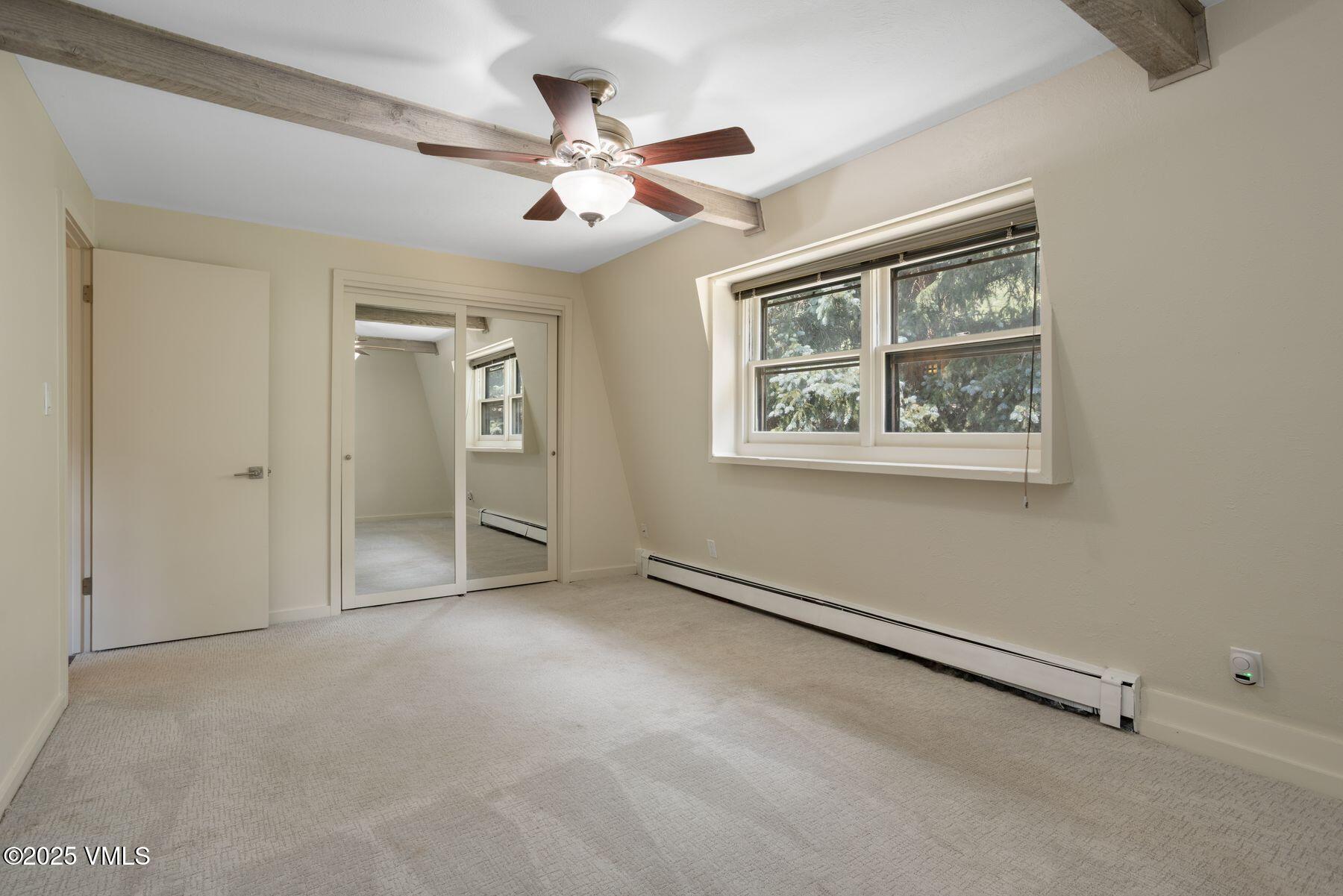 2456 Chamonix Lane, Unit B3 Vail, CO 81657 - Photo 26 of 29 wooden floor in an empty room with a window